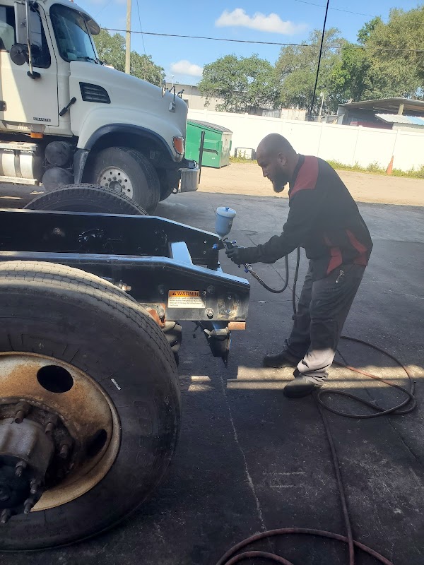 Mechanic working on heavy truck at Pineda's